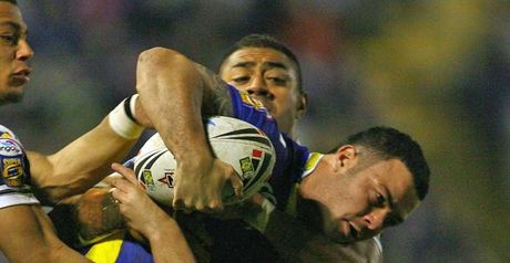 Warrington's Chris Bridge is tackled during the victory over Hull FC