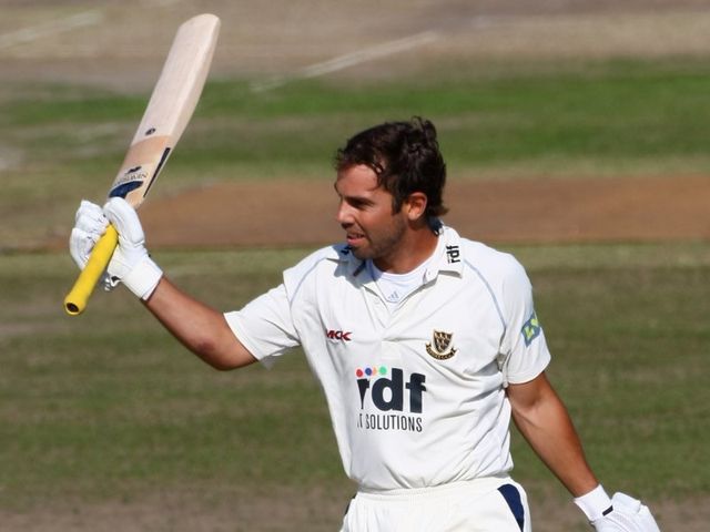 Hopkinson celebrates his century on Saturday.