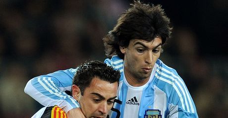 Exciting encounter: Xavi and Javier Pastore tussle for the ball