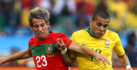 Stalemate: Fabio Coentrao and Dani Alves tussle for the ball