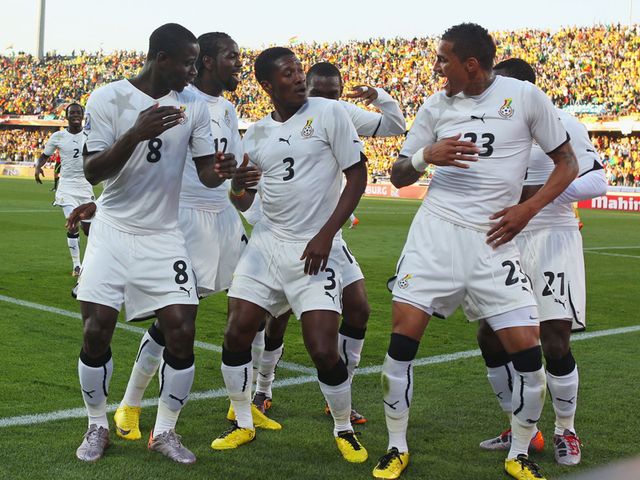Ghana celebrate Asamoah Gyan's penalty.