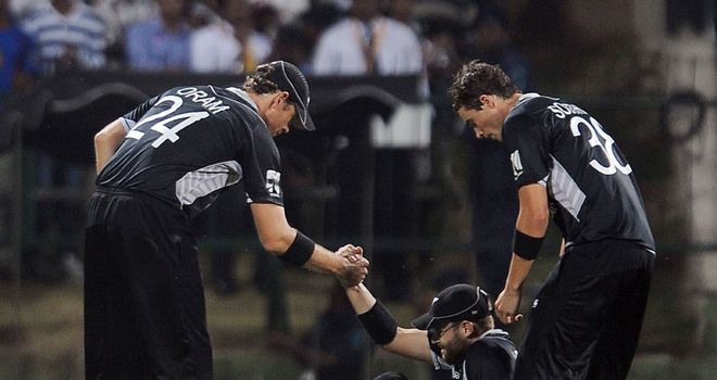 Knee injury: Vettori is helped to his feet but soon left the field