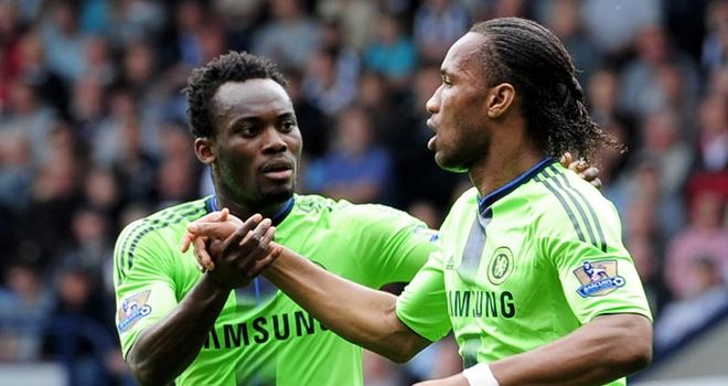 Equaliser: Drogba celebrates his close-range finish with Essien after a Shorey mistake