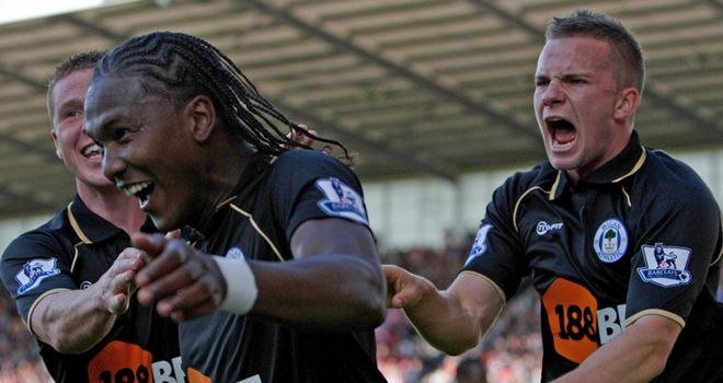 Rodallega: Is congratulated by team-mates...