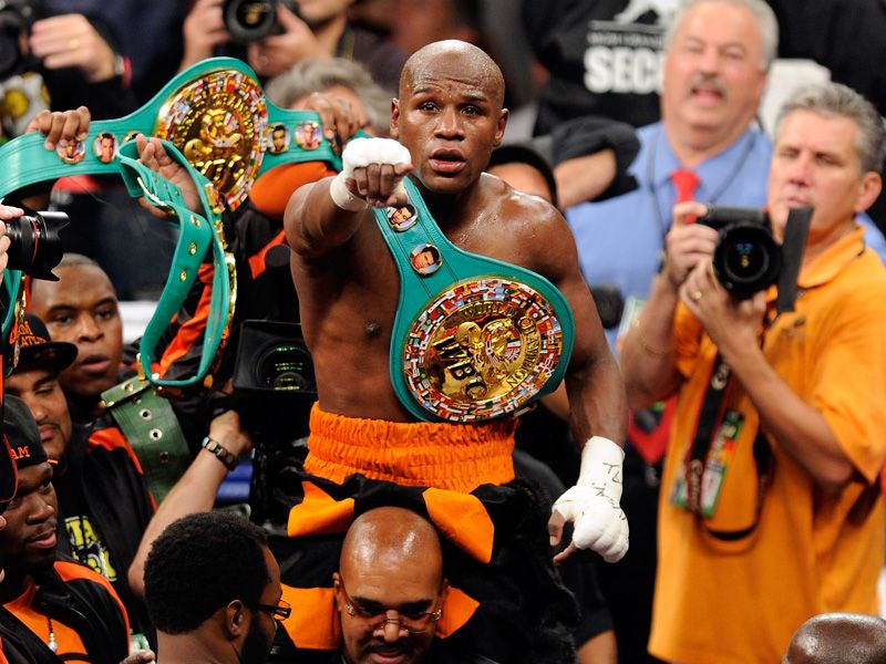 Mayweather enjoyed celebrating as he improved to 42-0 and claimed the WBC world welterweight title.