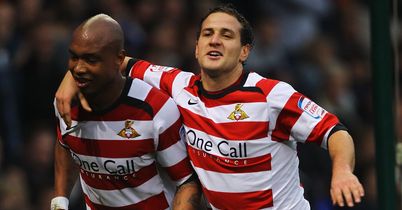 Diouf: Celebrates with fellow scorer Sharp