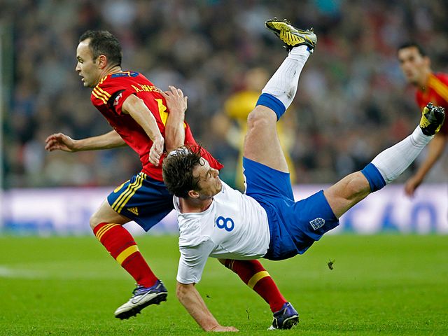 Scott Parker crashes to the turf