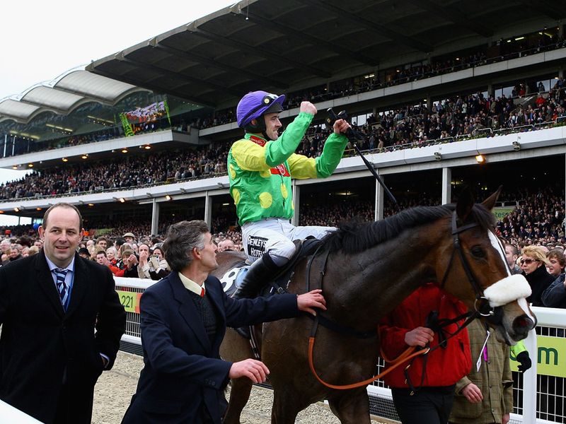...Ruby Walsh celebrates as he's the first horse to regain the title...