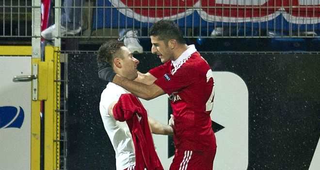 Wisla's Patryk Malecki celebrates his goal with team-mate David Biton