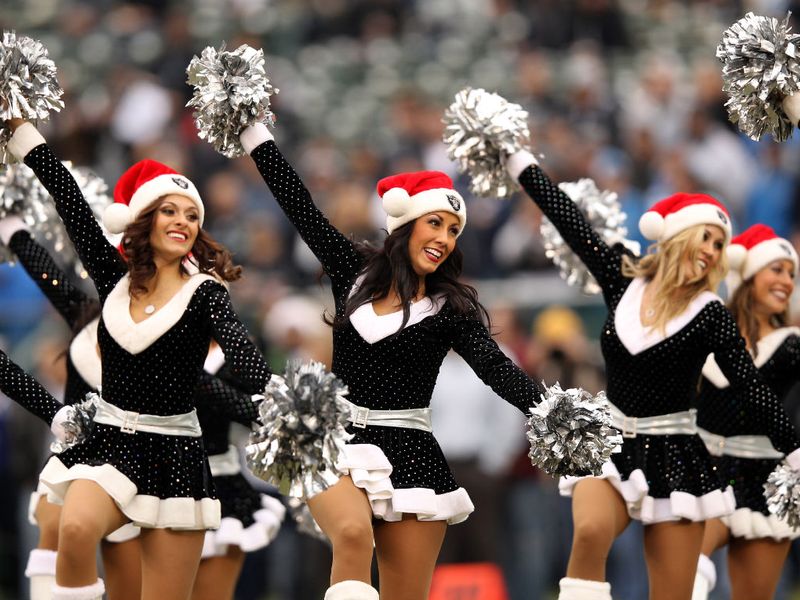The Oakland Raiders cheerleaders have a black Christmas uniform - of course!