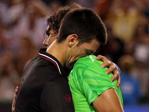 Djokovic and Nadal embrace after almost six hours of tennis in Melbourne