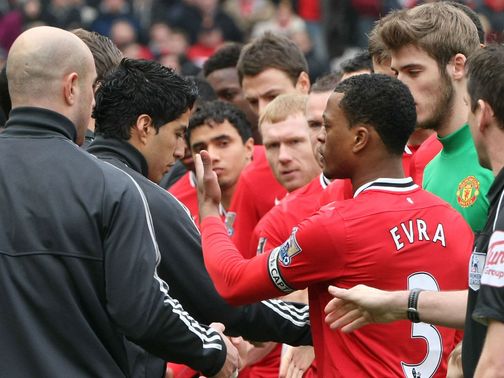 Suarez and Evra: Urged to shake hands before kick-off