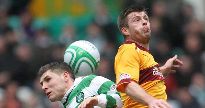 Hooper (l): Battles for the ball during the clash