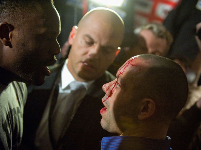 Haye's trainer Adam Booth has blood running down his forehead