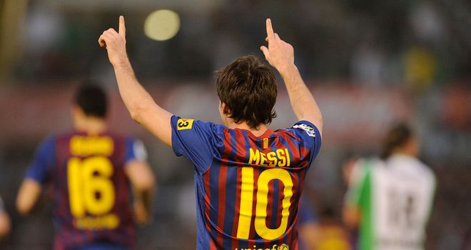 Messi celebrates one of two goals against Santander