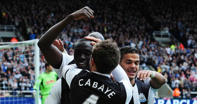 Papiss Cisse celebrates his 11th goal in 10 Premier League games since joining Newcastle
