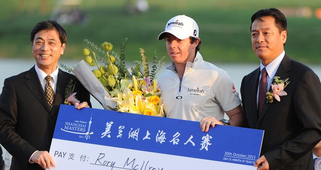 Rory McIlroy: Displaying the huge cheque he won last year in Shanghai