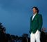 A cut above: Watson, resplendent in his new green jacket, poses for the photographers