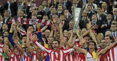Atletico Madrid lift the Europa League trophy after a 3-0 victory over Athletic Bilbao.
