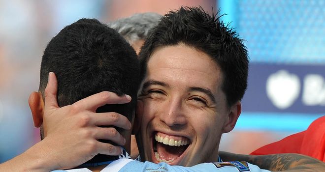 Samir Nasri celebrates winning the title in his first season at Manchester City