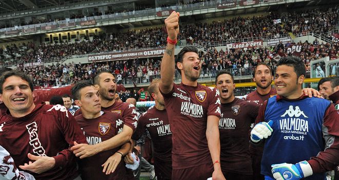 Torino's players celebrate winning promotion to Serie A