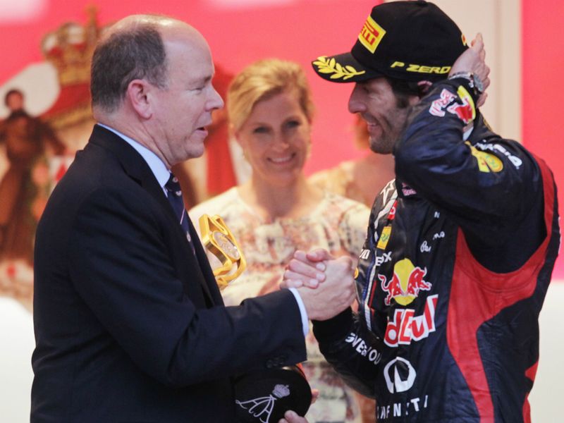 Prince Albert gives Mark Webber his trophy