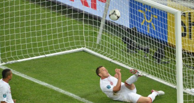 John Terry clears the ball from under his own crossbar against Ukraine