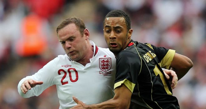 No fear  Moussa Dembele and Wayne Rooney tussle for  ball during
