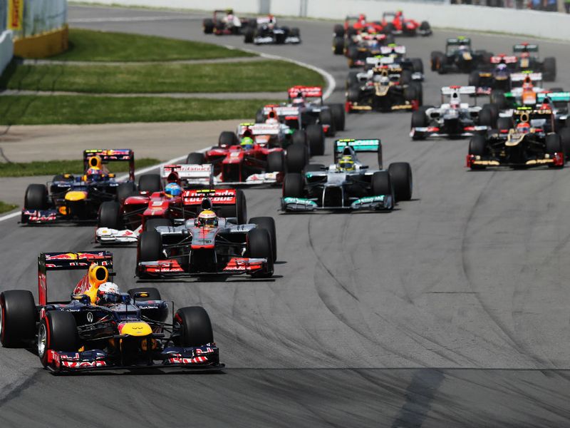 Vettel leads into turn 1