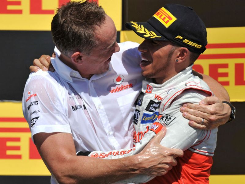 Martin Whitmarsh and Lewis Hamilton celebrate