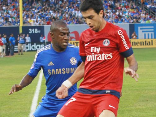 Javier Pastore battles with Gael Kakuta