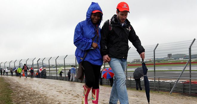 Muddy: Silverstone's car parks were reduced to quagmires by the rain