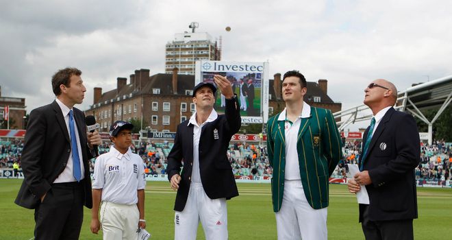 Toss: England captain Andrew Strauss flips the coin