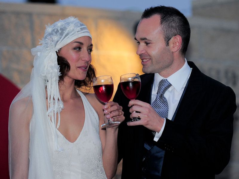 ...this time lifting a glass of wine to raise a toast to the newly weds.