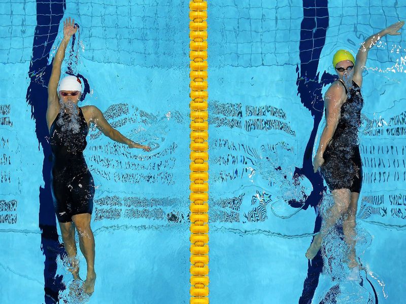 The second day at the Aquatics Centre gets off to a thrilling start, as Australia's Emily Seebohm sets a new Olympic Record in the Women's 100m Backstroke