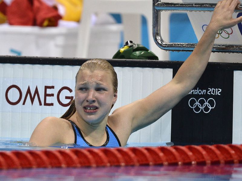 Lithuanian Ruta Meilutyte is overcome with emotion, as she qualifies for the semifinal of the Women's 100m Breaststroke with the fastest time