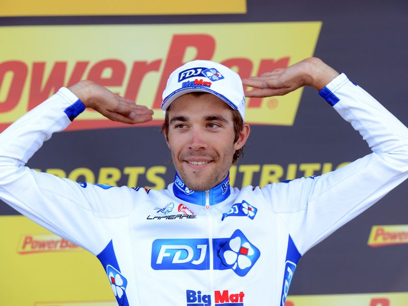 Pinot celebrates his victory on the podium...