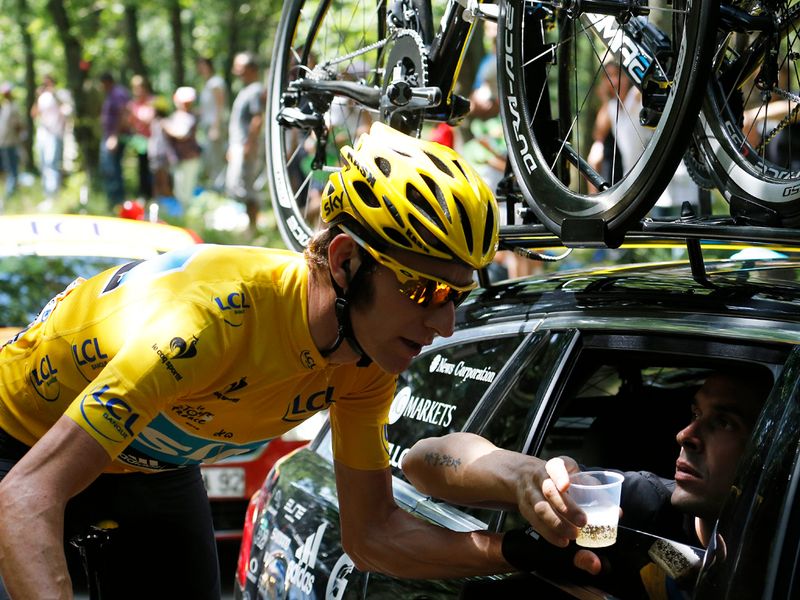 Wiggins gets a well-deserved glass of champagne after an epic performance over the last three weeks