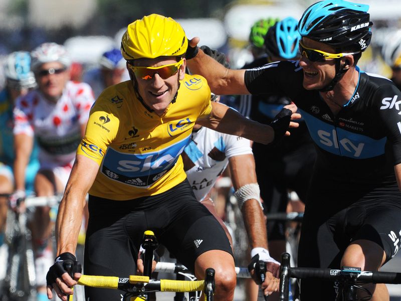 Wiggins celebrates his win as he crosses the line with Mick Rogers