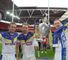 Brett Hodgson and brothers Joel and Michael Monaghan show off the spoils at Wembley