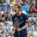 Andy Murray lost the first set to Marcos Baghdatis but fought back to earn a place in the men's singles quarter-finals.