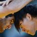 Ashraf Aliyev of Azerbaijan competes with Sohsuke Takatani of Japan in the men's freestyle 74 kg wrestling.