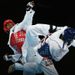 Lutalo Muhammad of Team GB takes on Tajikistan's Farkhod Negmatov, putting the difficult build-up to these Games behind him.