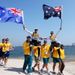 Australian sailors Mathew Belcher and Malcolm Page are welcomed onshore by team mates after winning gold in the men's 470 sailing.