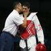 USA's Steven Lopez is comforted after losing to Ramin Azizov of Azerbaijan in the men's -80kg taekwondo preliminary round.