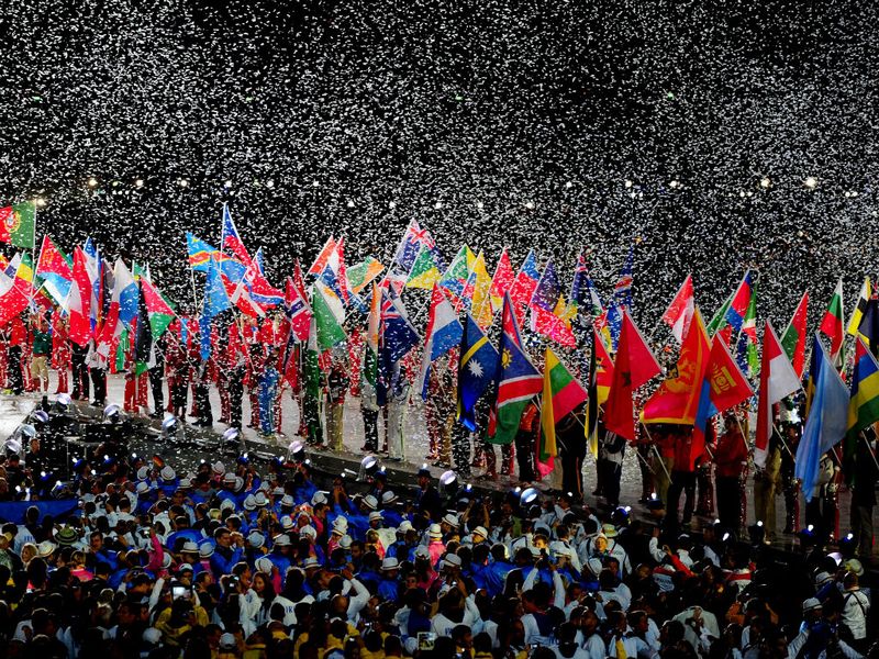 Athletes from all 204 nations flood into the stadium simultaneously