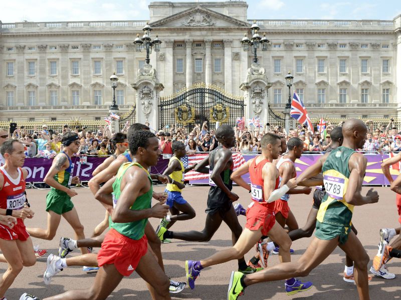 Historic Setting: Other athletes run past Buckingham Palace in London during the men's marathon