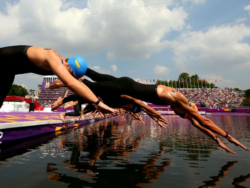 The swimmers dive in as the men's marathon 10km swim gets underway in the Serpentine.