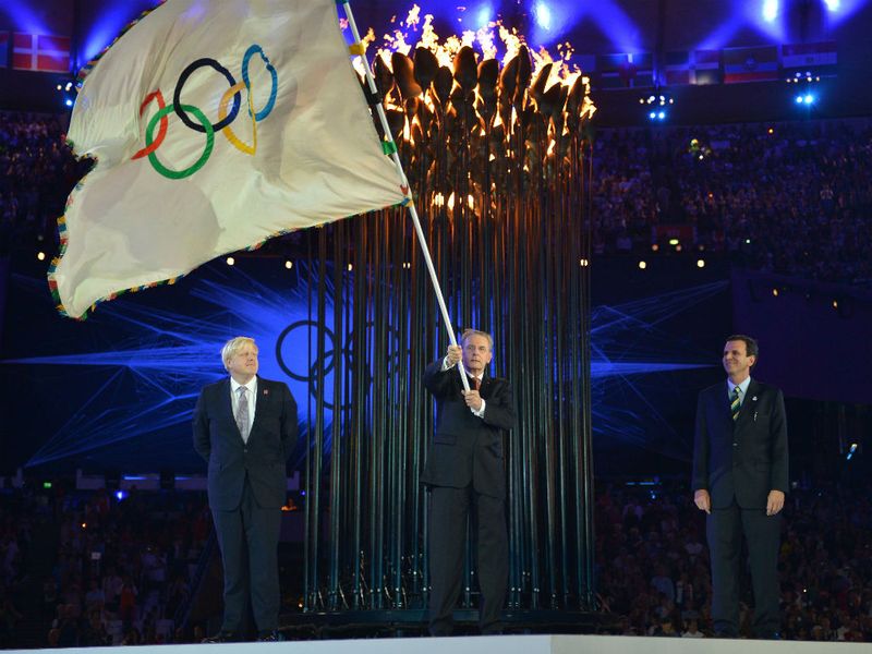 The Olympic Flag is passed to the Mayor of Rio de Janeiro, signifying the passing of responsibility to the Brazilian City