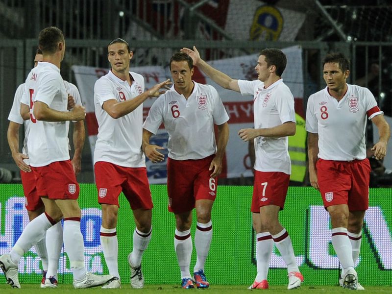 Jagielka celebrates with his team-mates after restoring parity against Italy.